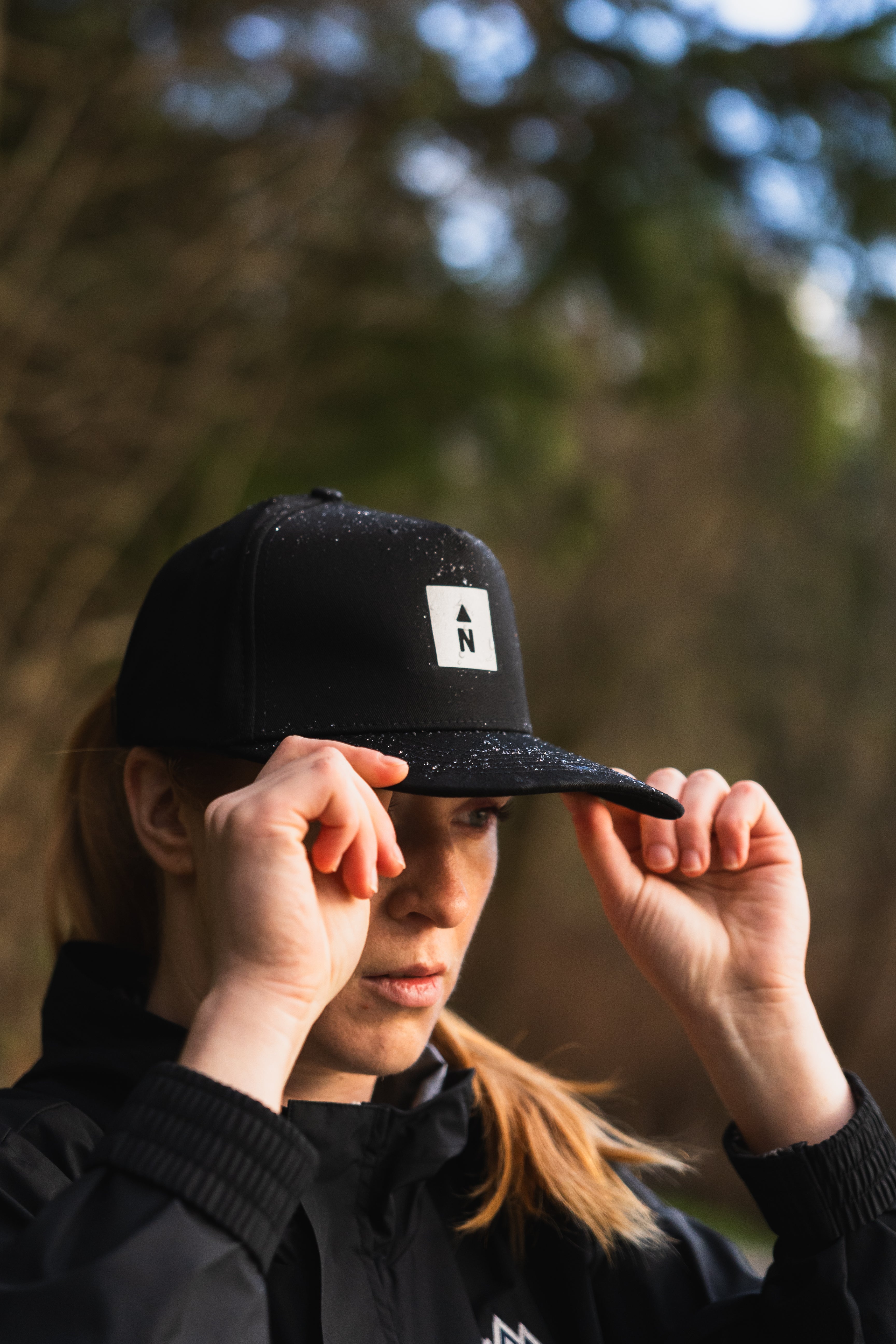Northbound Gear woman wearing cap and jacket in winter scene